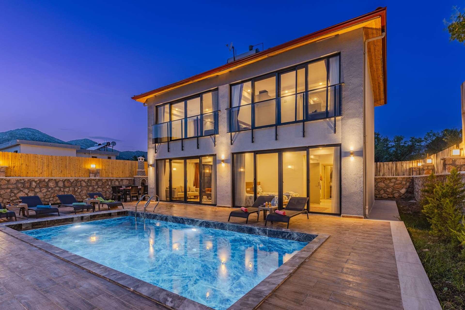 The same kind of villa lit from within at night
